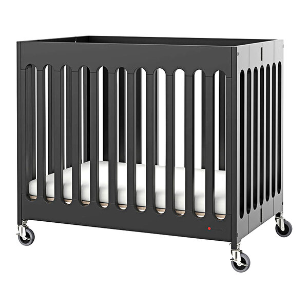 A black Foundations Boutique slatted wood folding crib with wheels.