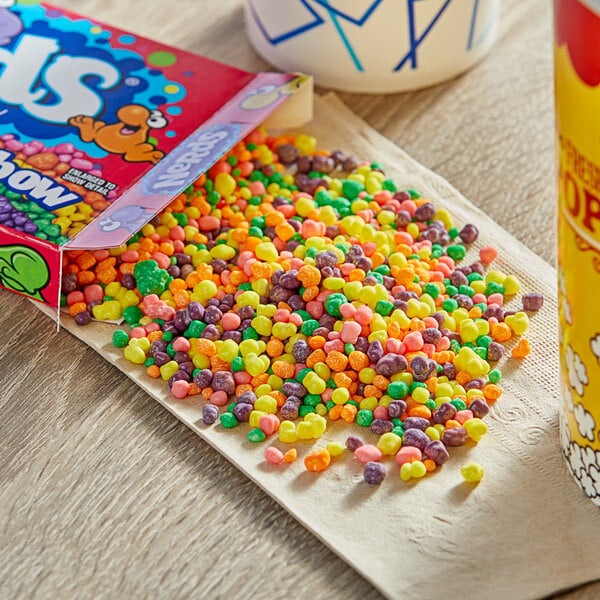 A Nerds candy box on a table with a yellow and white label and red design.
