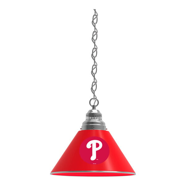 A red lamp shade with a white Philadelphia Phillies logo.