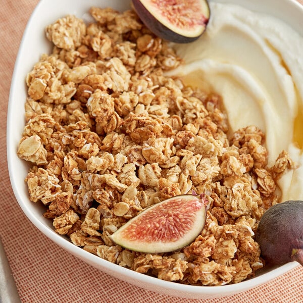 A bowl of Nature Valley Oats and Honey Parfait Granola with yogurt and figs.