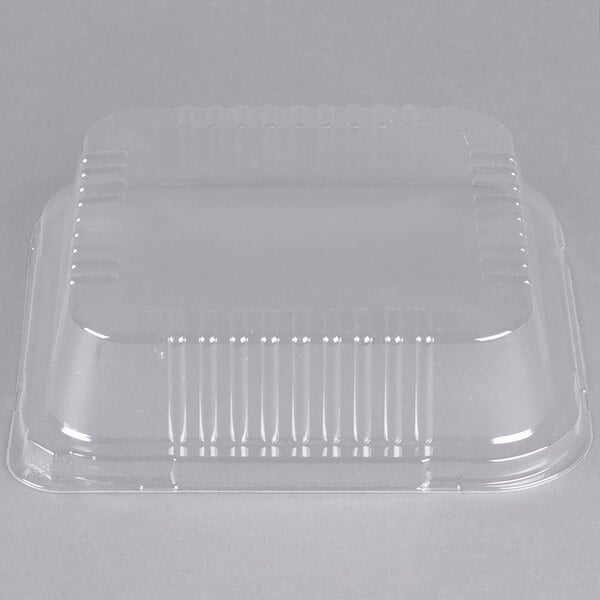 A clear plastic lid for a square foil cake pan.