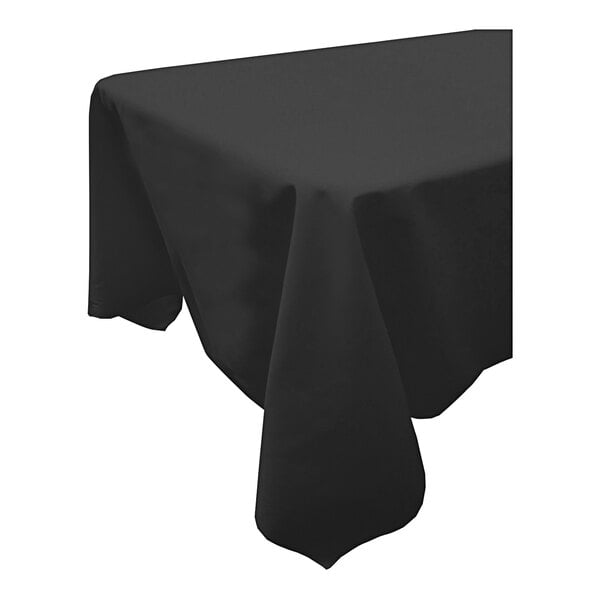 A black Snap Drape rectangular table cover with a folded edge on a table.