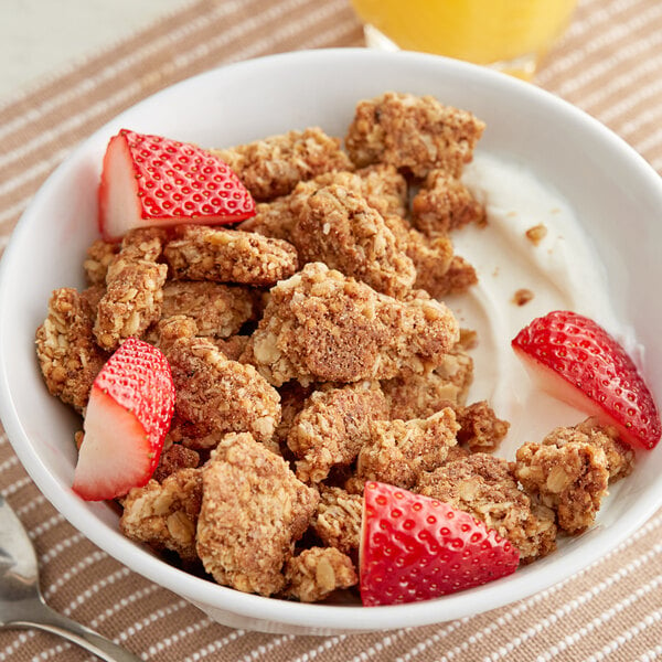 A bowl of Nature Valley Oats and Honey Granola with strawberries.
