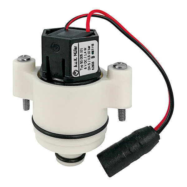 A white and black Chicago Faucets electronic solenoid valve with red wires.
