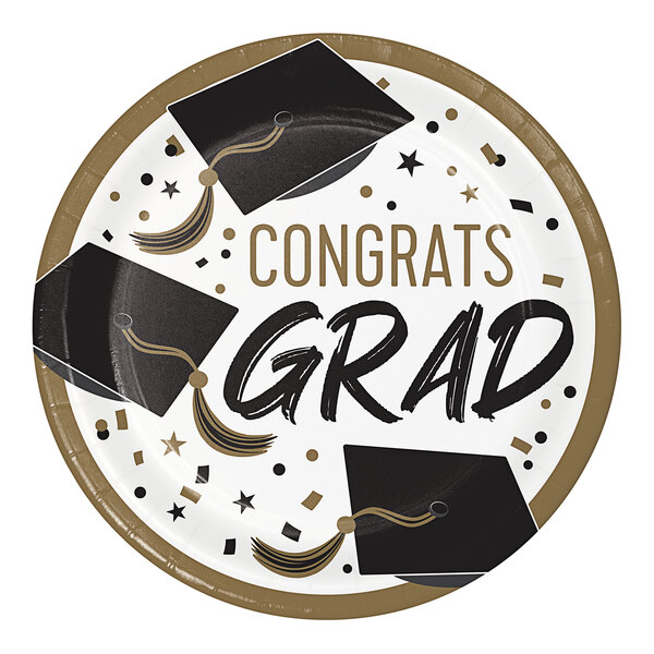 A white Creative Converting paper plate with graduation caps and stars in gold.