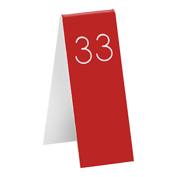 A red table tent with white number 33 on it.