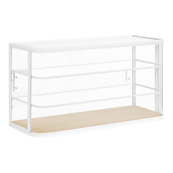 A white Cal-Mil bakery display case with clear glass shelves.
