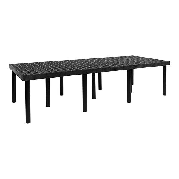 A black Benchmaster platform display table with legs.