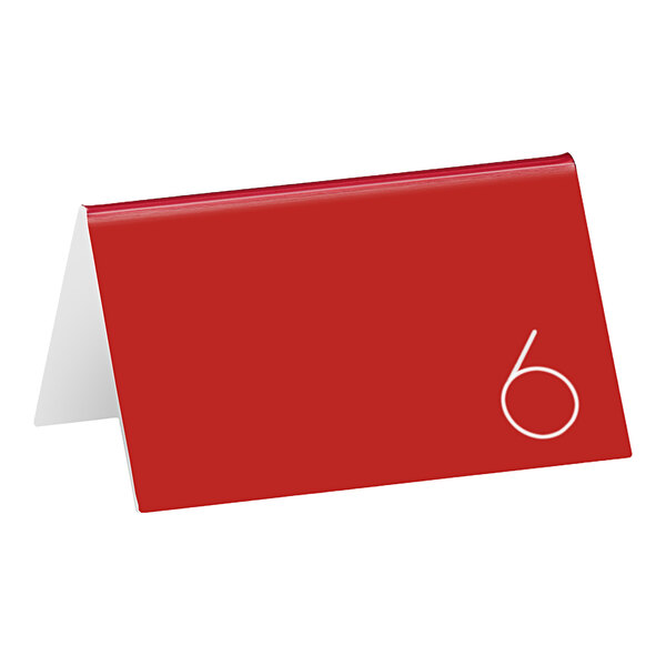 A red rectangular Cal-Mil table card with white numbers reading "6"
