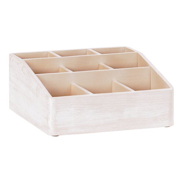 A white wooden Cal-Mil condiment organizer with compartments.