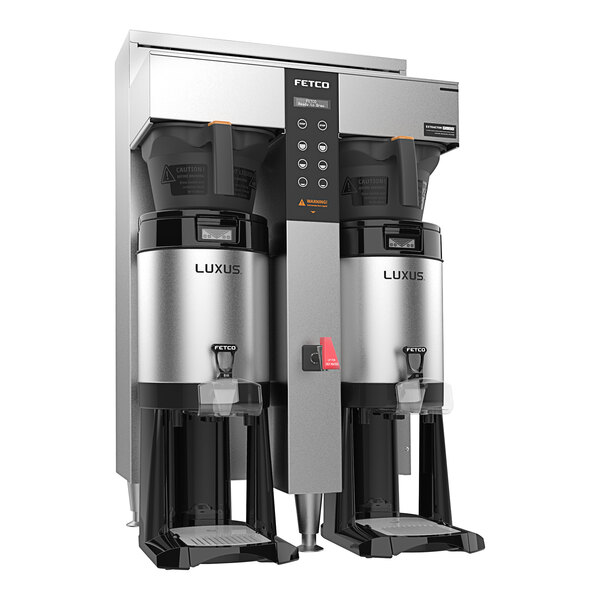 A Fetco CBS-1252 Plus Series twin automatic digital coffee brewer with two plastic brew baskets.