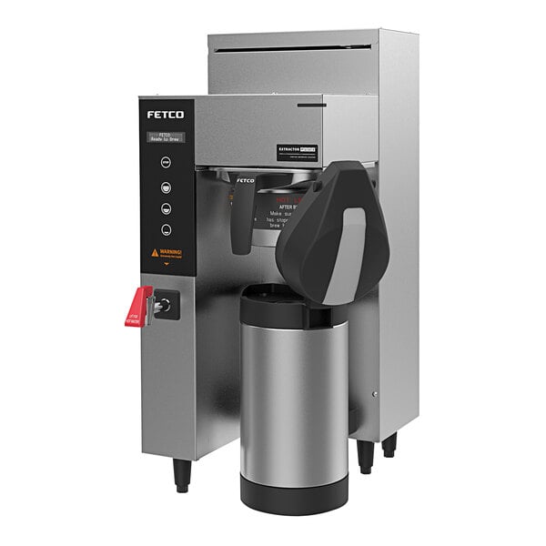 A Fetco CBS-1231 Plus coffee machine with a metal container.