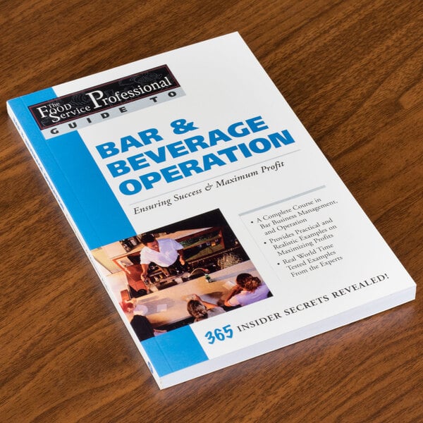 A book titled "Bar & Beverage Operation" on a table.