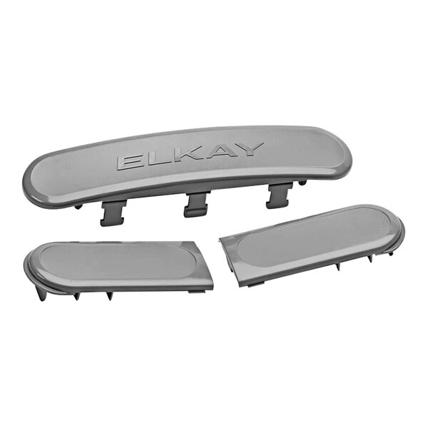 A grey plastic Elkay cover with a logo on it.
