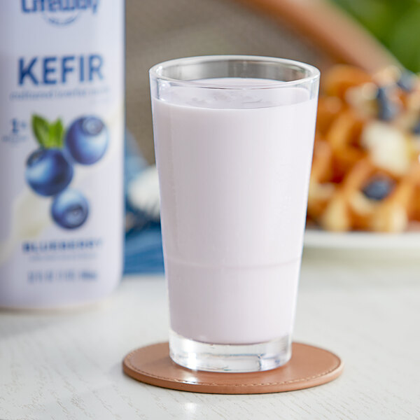 A close up of a bottle of Lifeway Low-Fat Blueberry Kefir on a white background.