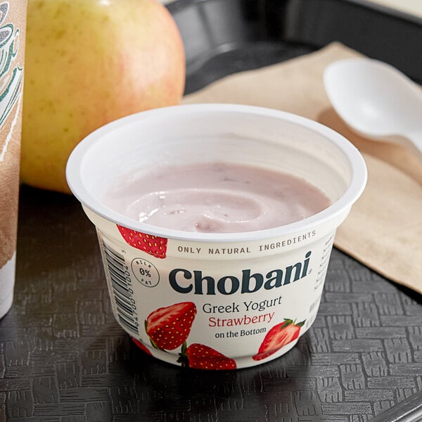 A Chobani Non-Fat Strawberry Greek Yogurt cup with a spoon.