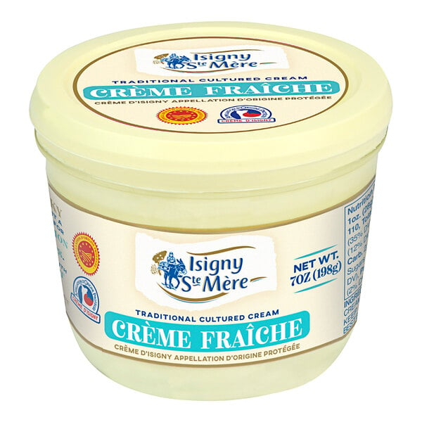 A container of Isigny Sainte-Mere creme fraiche on a white background.