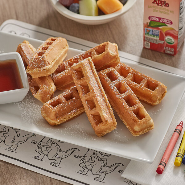 A plate of Krusteaz Whole Grain Belgian Waffle Sticks with syrup.