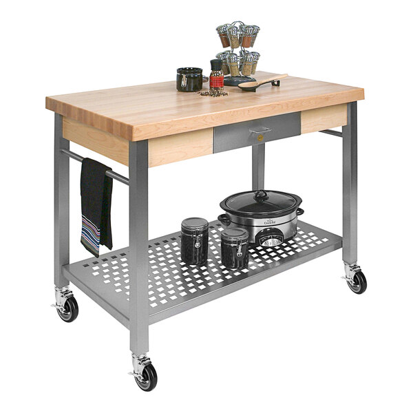 A John Boos Cucina Grande kitchen cart with a wooden surface holding utensils.