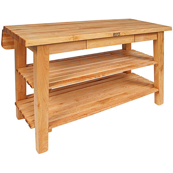 A John Boos maple kitchen island table with shelves.