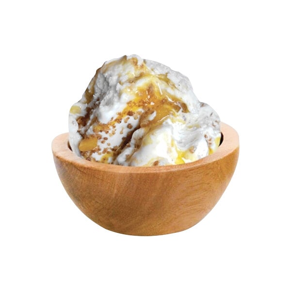 A bowl of G.S. Gelato Peach Cobbler Gelato with a scoop of ice cream.