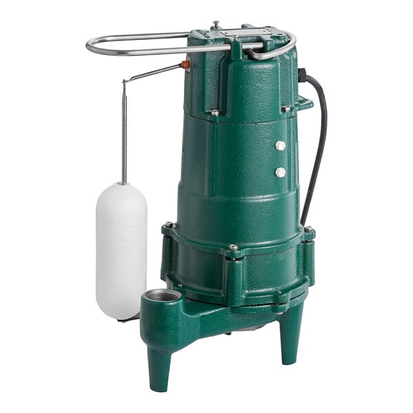 A green and white Zoeller Shark grinder pump with a white base.