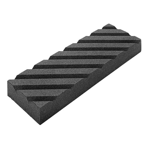 A black silicon carbide block with a striped pattern.