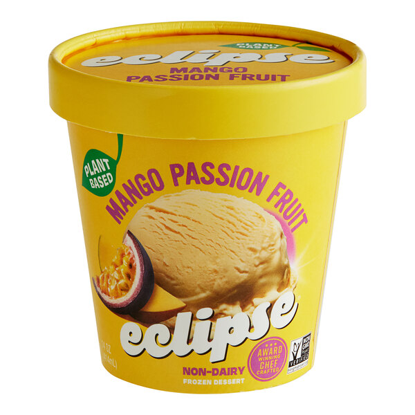 A yellow container of Eclipse Foods vegan mango passion fruit ice cream.