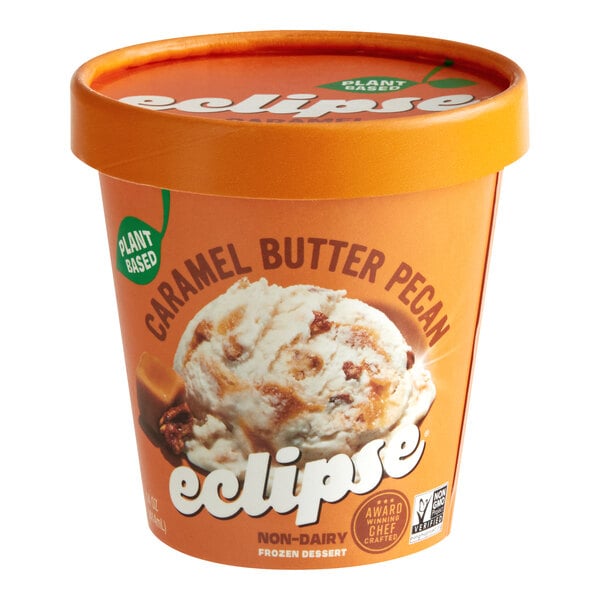 A container of Eclipse Foods vegan caramel butter pecan ice cream on a table.