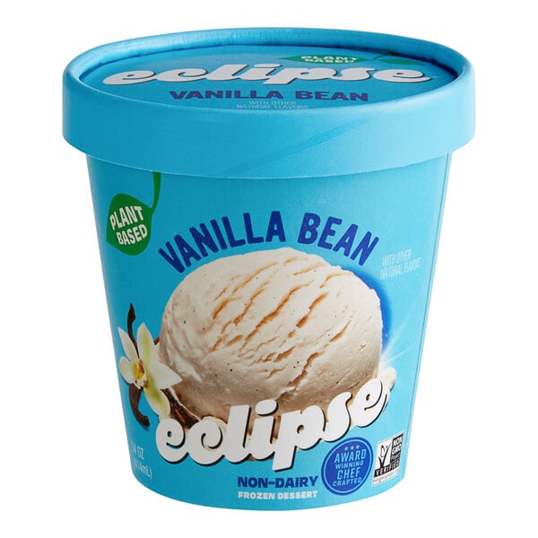 A scoop of Eclipse Foods vegan vanilla ice cream in a blue container.