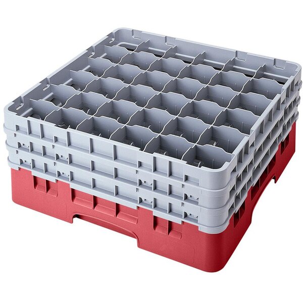 A red and gray plastic Cambro Camrack with several compartments.