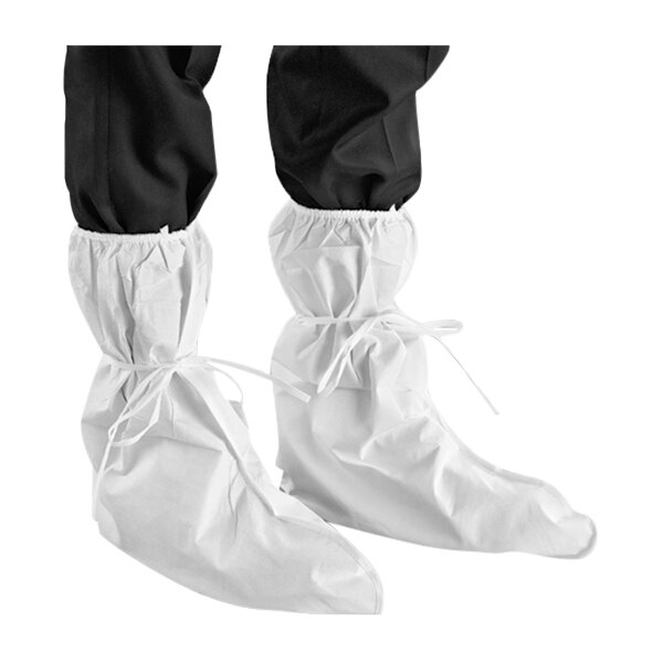 A pair of white boot covers with a white and black anti-slip sole.