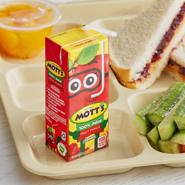 A tray of food with a carton of Mott's Fruit Punch and sandwiches.