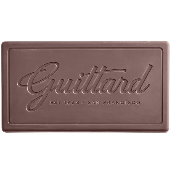 A close-up of a Guittard Solitaire chocolate bar with the word "Guittard" on it.