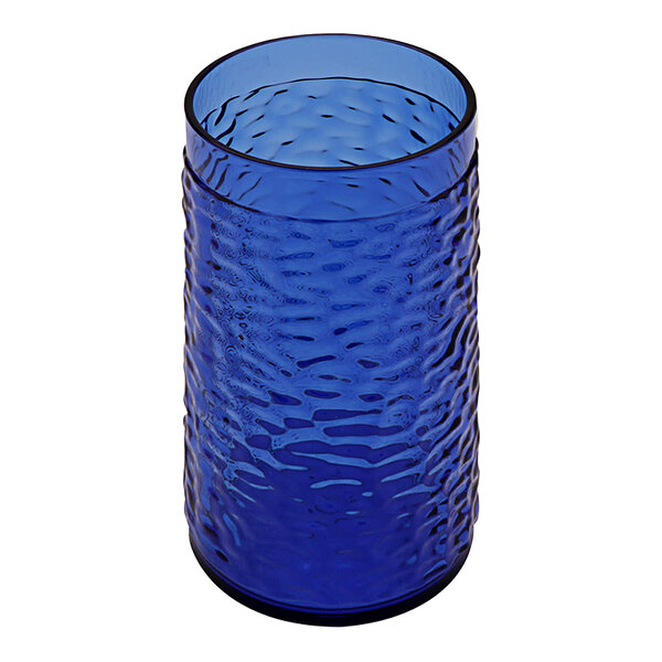 A close-up of a GET cobalt blue plastic tumbler with a wavy pattern.