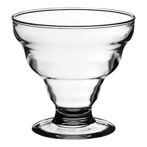 A clear plastic dessert dish with a base and a rim on top.