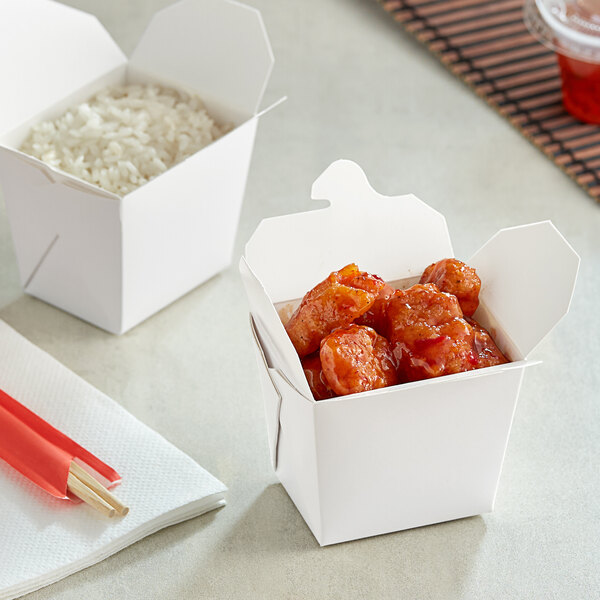A white Emperor's Select take-out box with rice inside.