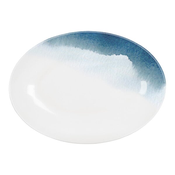 A white oval melamine platter with a blue and white watercolor design.