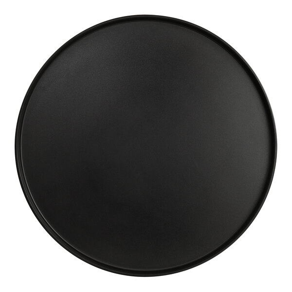 A black round melamine platter with a raised rim.