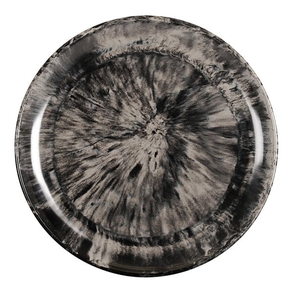 A black and ivory melamine plate with a swirl design.