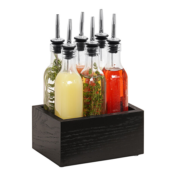 A Cal-Mil rustic pine wood caddy with 6 glass flavoring syrup bottles inside.