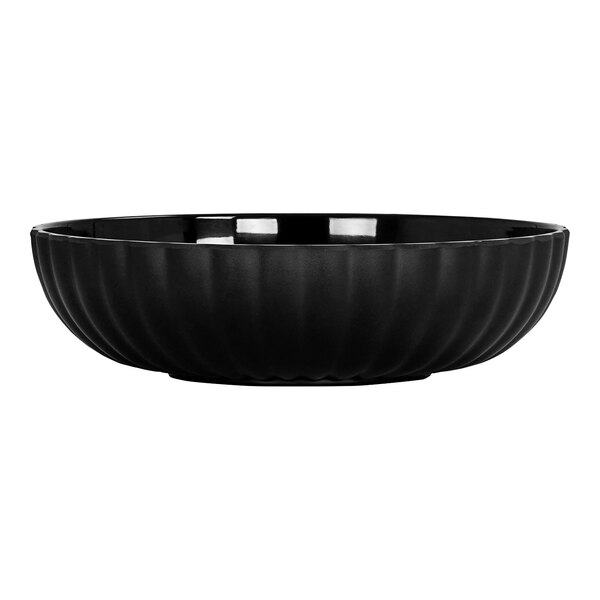 A black Cal-Mil melamine bowl with a scalloped edge.