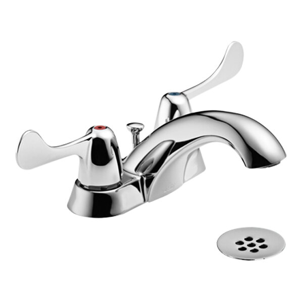 A Delta chrome deck-mount faucet with blade handles and a metal grid strainer.