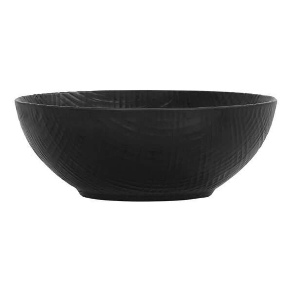 A black Cal-Mil Sedona coupe melamine bowl with a textured pattern.