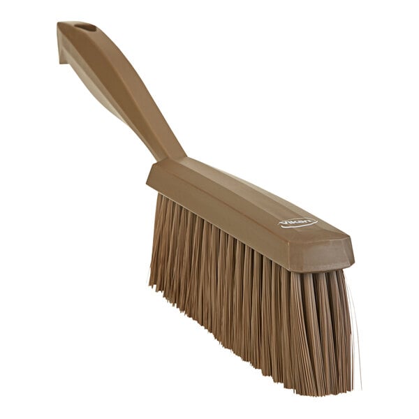 A brown Vikan hand brush with bristles and a handle.