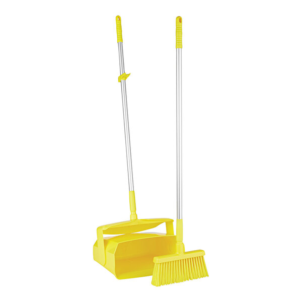 A yellow Remco lobby broom and dustpan set with a yellow handle.