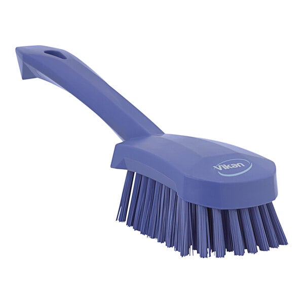 A purple Vikan washing brush with a handle.