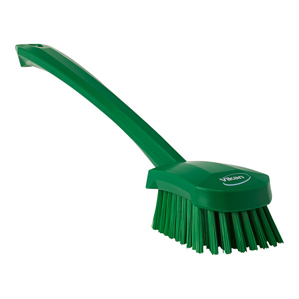 A green Vikan washing brush with a long handle.