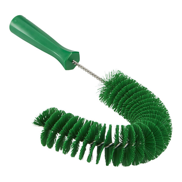 A Vikan green brush with a green plastic handle.