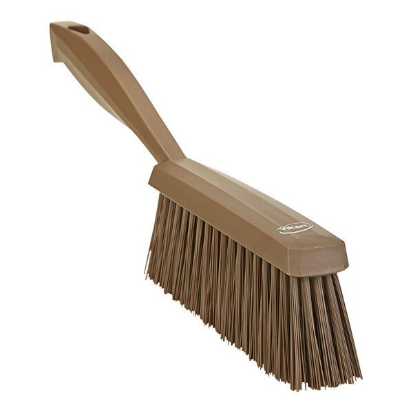 A brown Vikan hand brush with a handle.